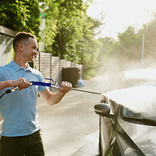 Image of a man washing a car with TurboJet Wash